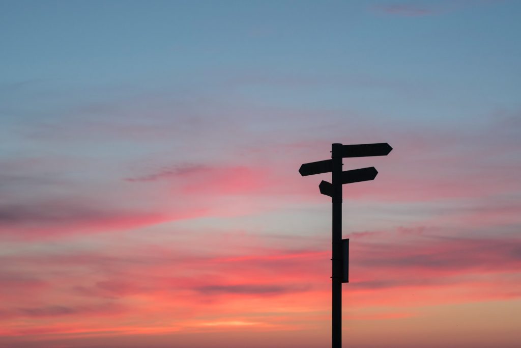 A photo of a signpost to indicate a choice must be made whether to embrace leadership or not